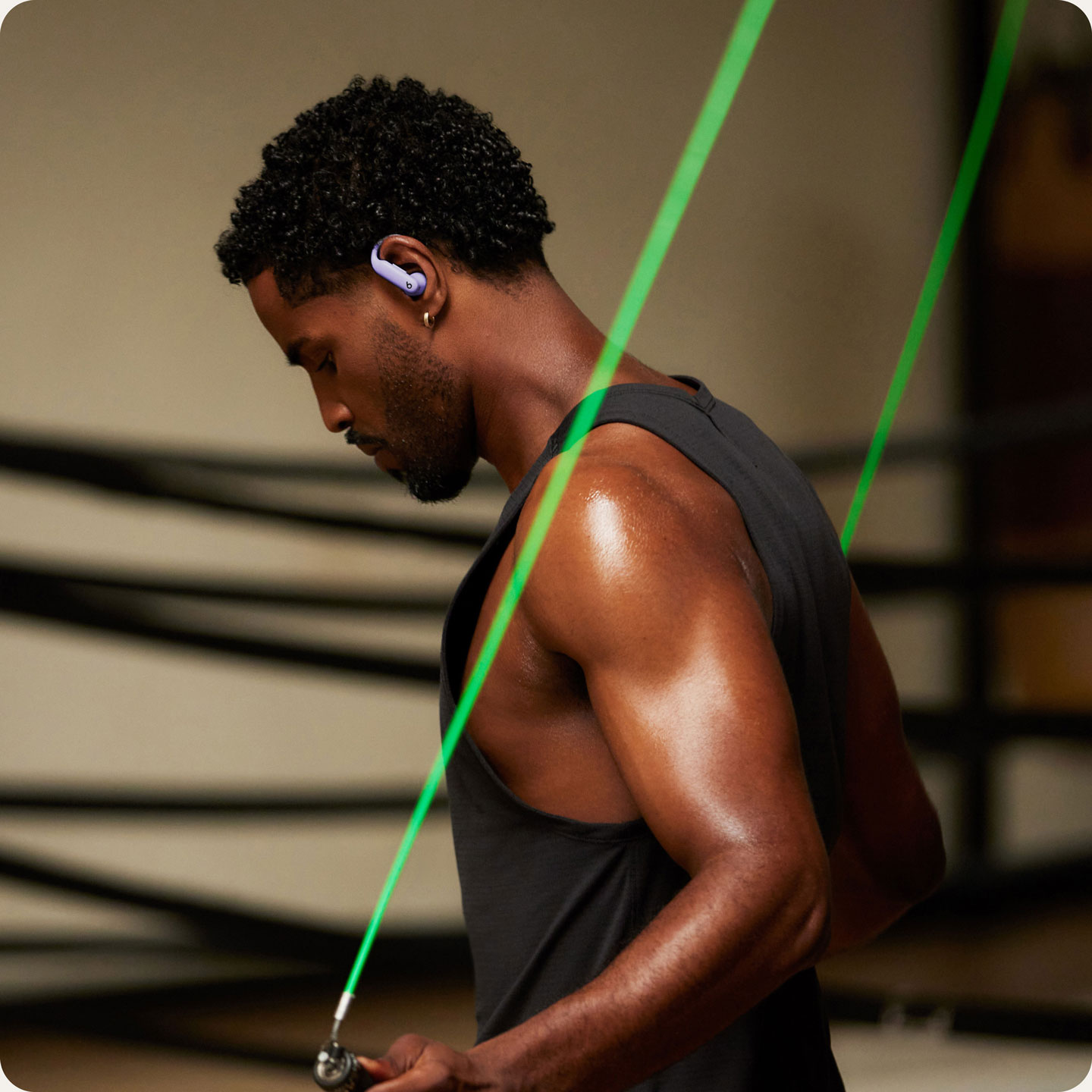 Person wearing Powerbeats Pro 2 earbuds, jumping rope
